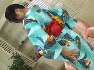 Megumi Harukalovely japanese babe in costume fondles her pussy