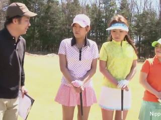 Cute Asian girls play a game of strip golf